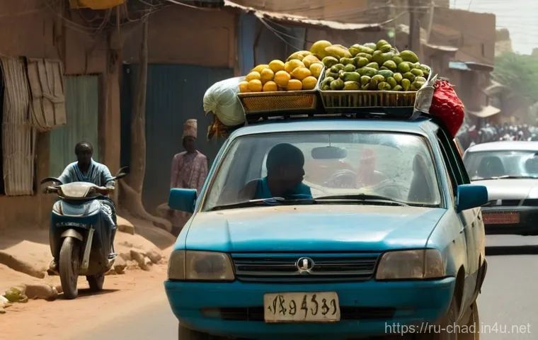 차드의 특이한 교통 문화 - A dynamic, wide-angle shot of a bustling street in N'Djamena, Chad, during a bright, sunny day. The ...